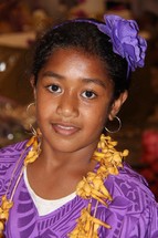 teen girl wearing a lei 