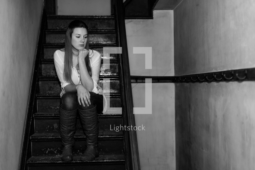 teen girl sitting on stairs