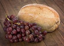 Grapes and Bread on a Table