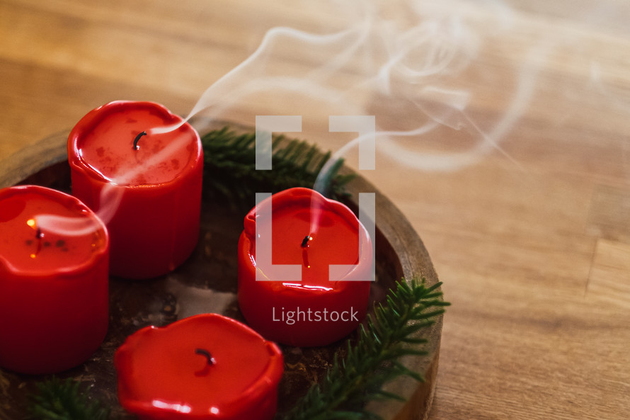 smoke from extinguish red candles 