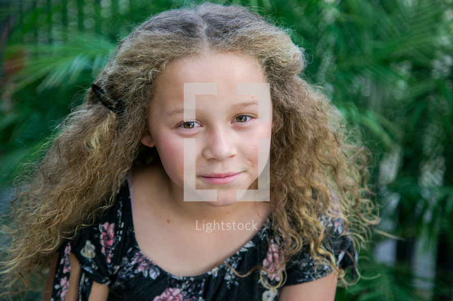 portrait of a girl with curly hair 