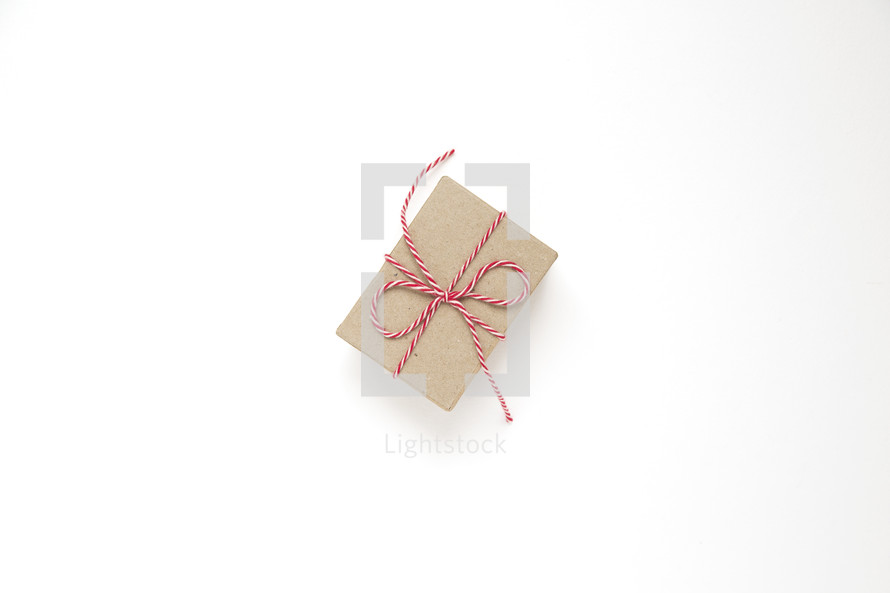 gift box with red and white yarn 