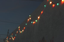 Christmas lights on the side of a wall 