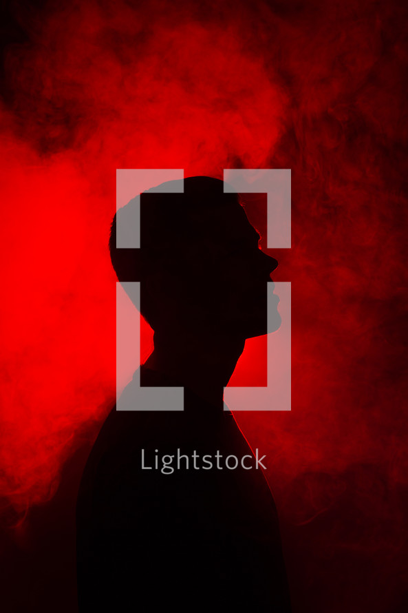 silhouette of a man with red backlight 