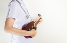  a healthcare worker holding a musical instrument 