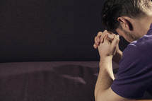 A man kneeling in prayer