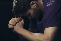 A man in reverent prayer
