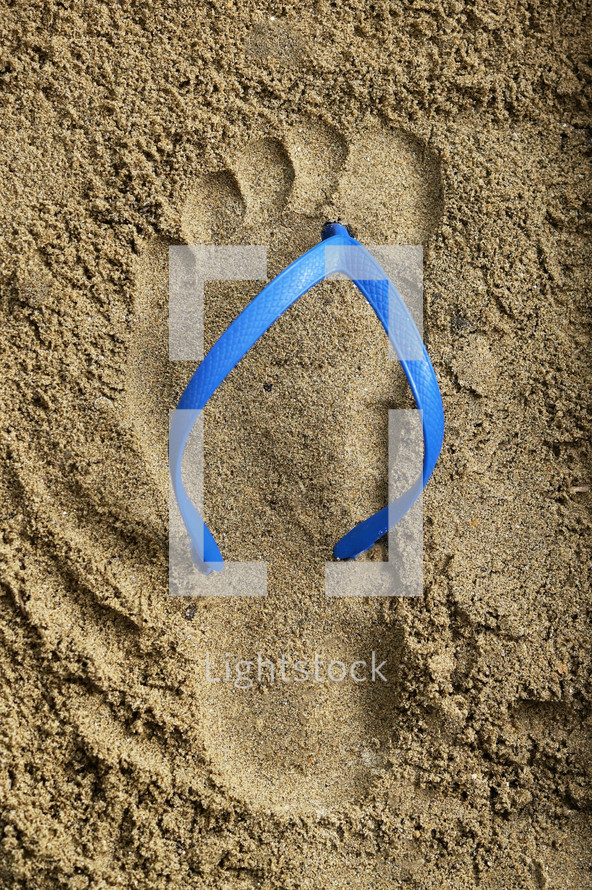 Abstract Footprint Blue Rubber Beach Flip Flops on Sand