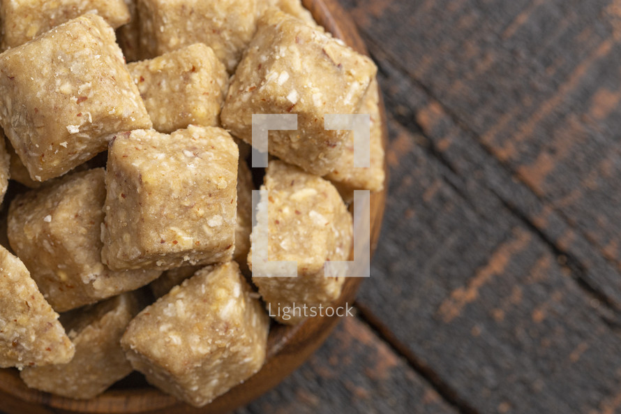 Vanilla and Almond Granola Energy Bites on a Wooden Countertop