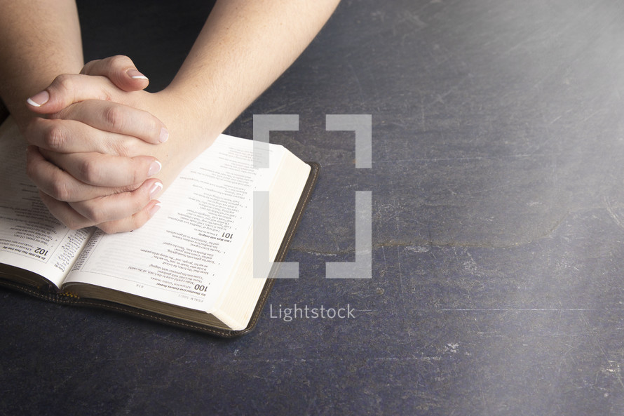  Woman Studying Her Bible at a Rustic Wood Table