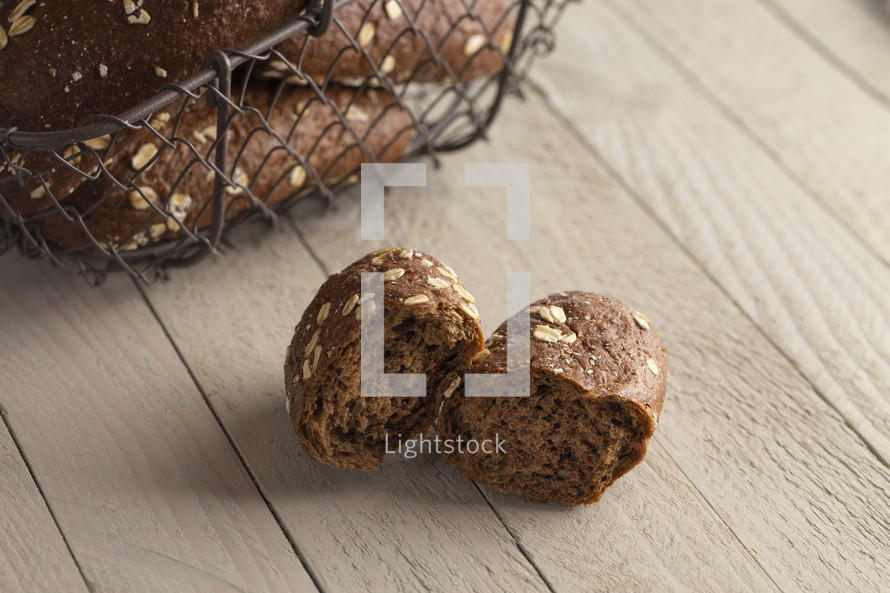 Dark Brown Bread with Oats on a Wooden Table