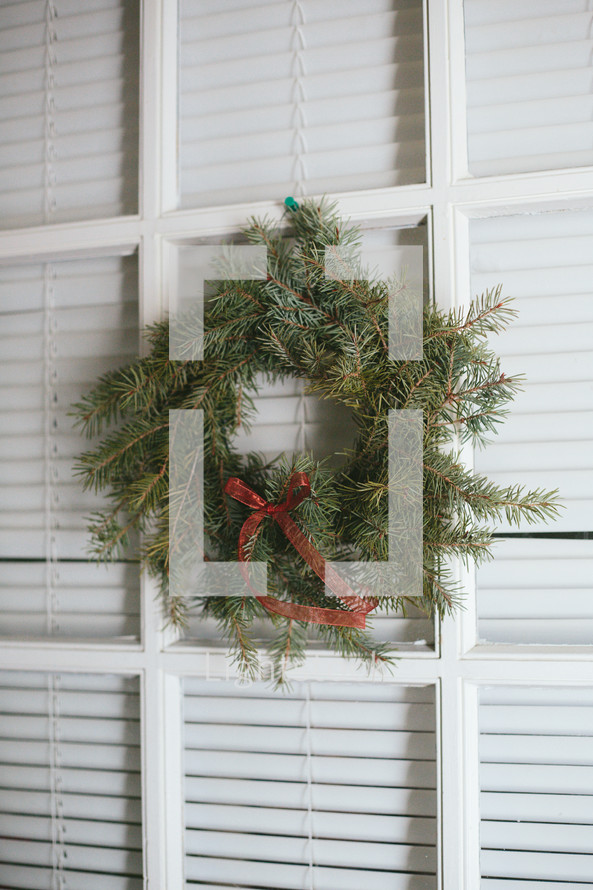 Christmas wreath on a window 