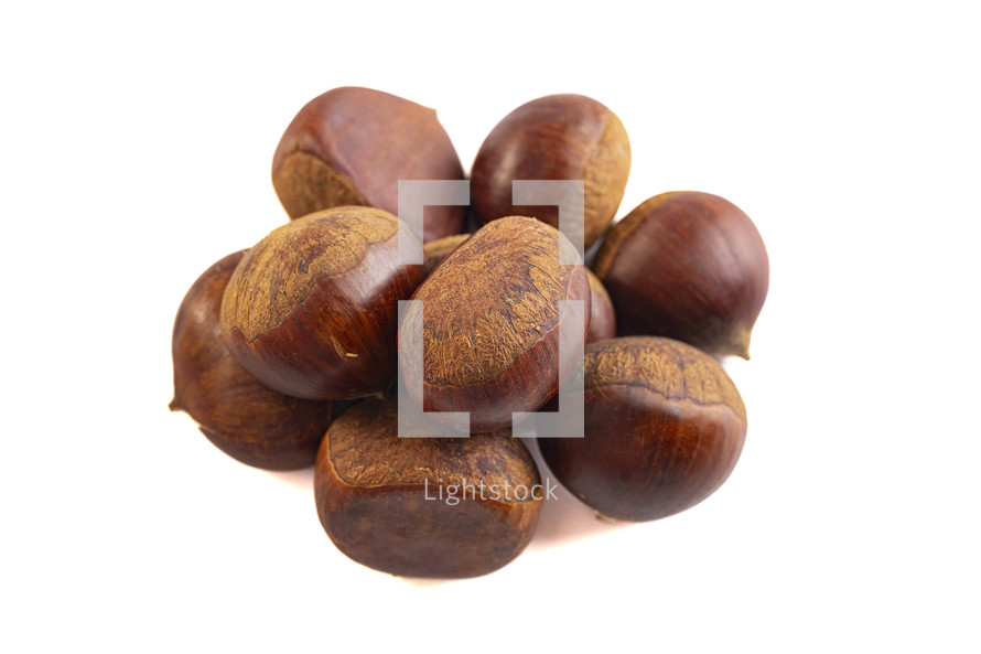 Group of hazelnuts on a white background