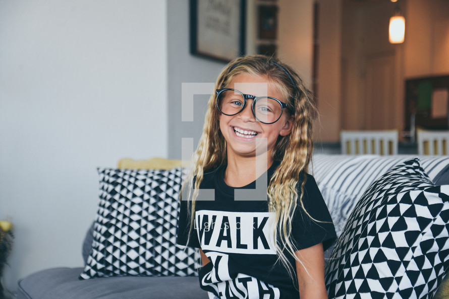 smiling girl in glasses 