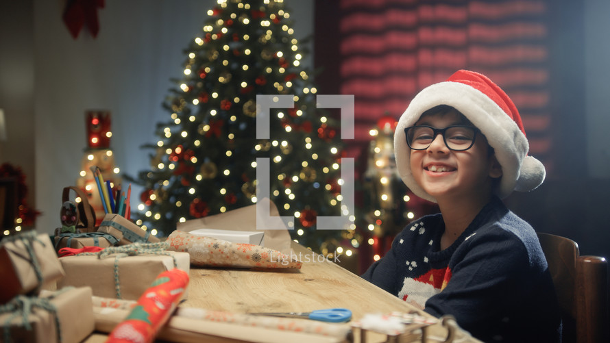 Kid Smile During Christmas Day On The Desk