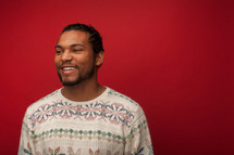 headshot of a man in a Christmas sweater 