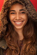 headshot of a woman in a winter coat with a hood 
