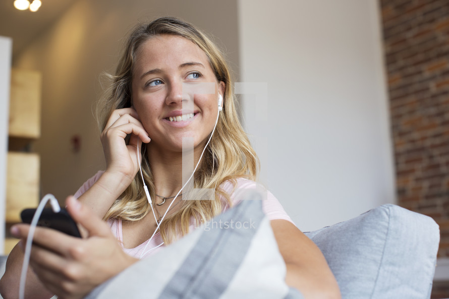 a woman listening to a podcast 