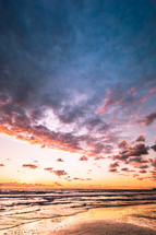 clouds over a shore at sunset 