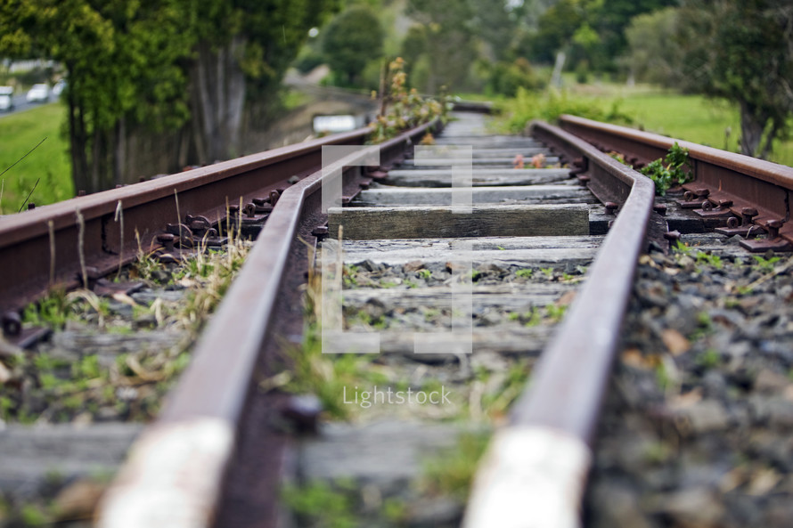 Railroad tracks leading through the countryside.