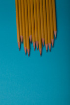 sharpened pencils on a blue background 