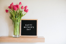 tulips in a vase and a Happy Mother's day sign