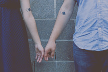 a couple with matching tattoos 