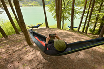young man resting in a hammock 