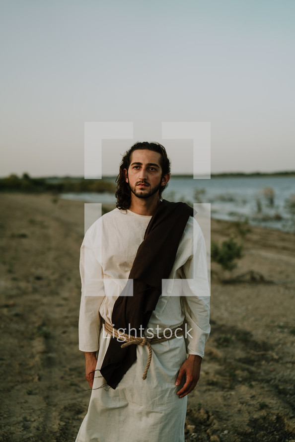 Jesus standing on a beach 