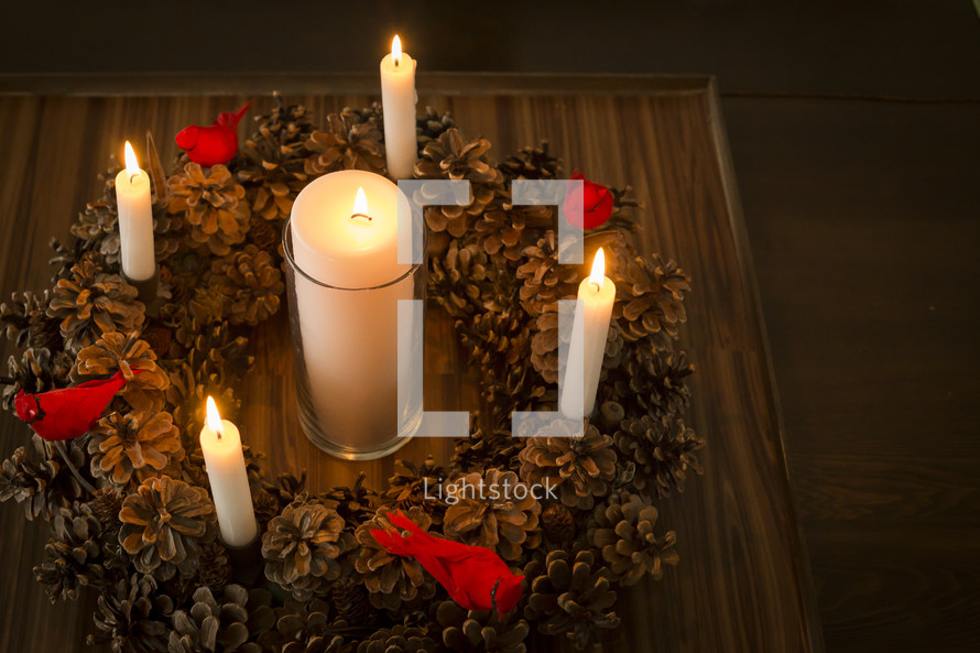centerpiece, candles, pine cone, wreath, table 
