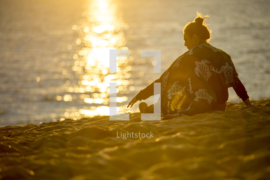 woman sitting on a beach 