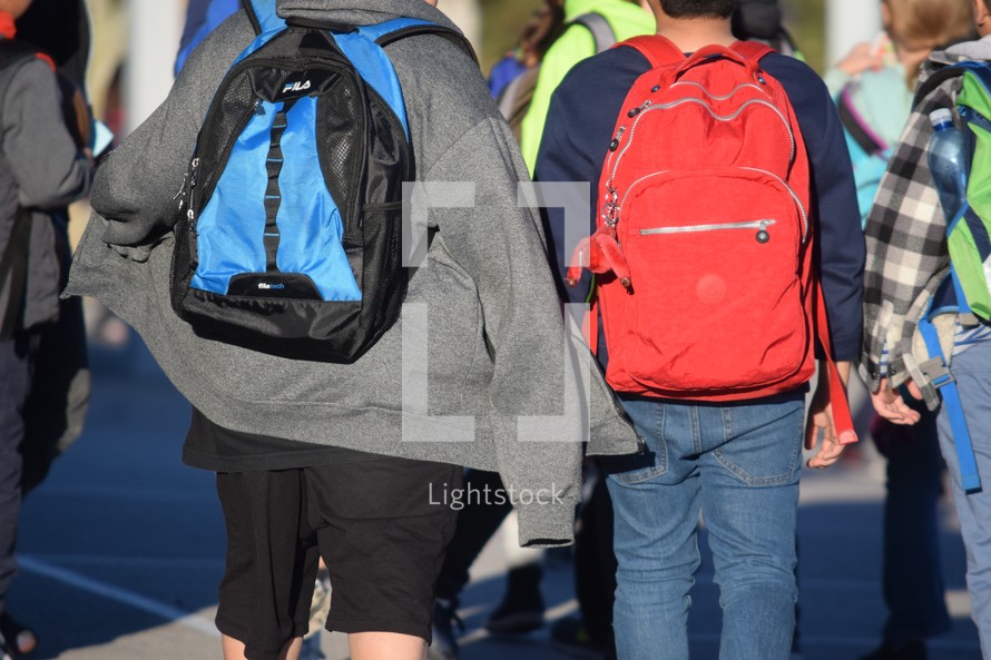 boys walking home after school 