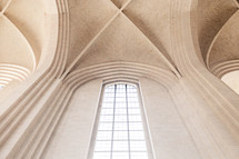arched ceiling and tall windows in a cathedral 