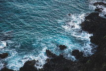 ocean water along a rocky shore 