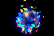 rainbow of bokeh heart lights 