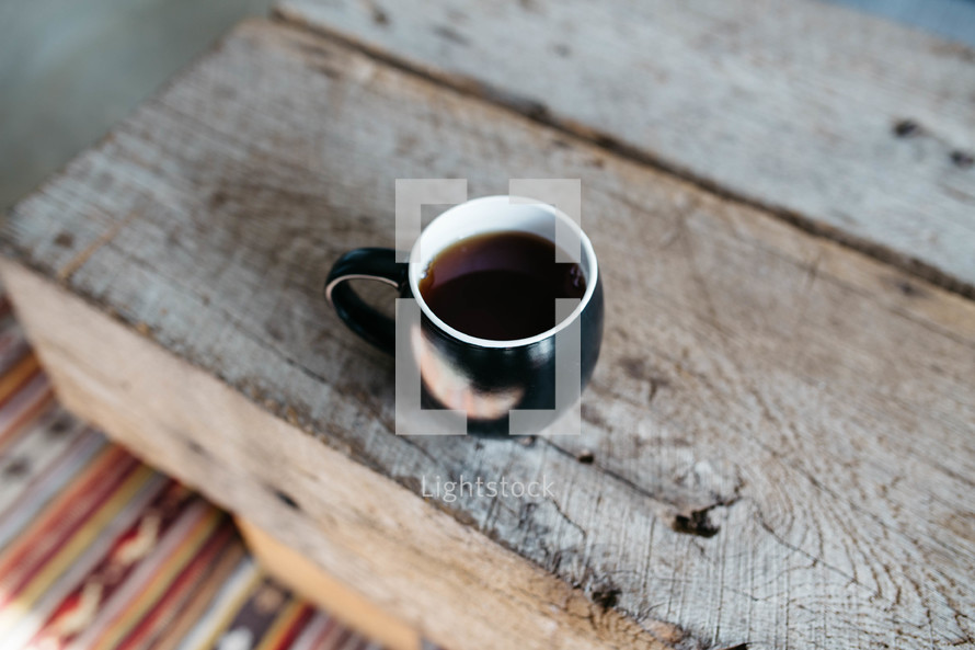 coffee in a mug on a wood table 