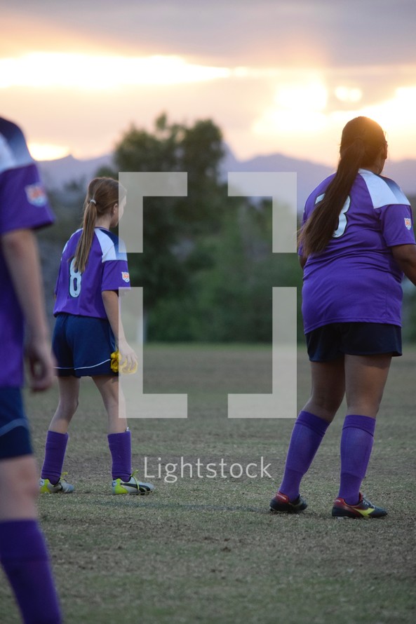 female athletes on the soccer field 