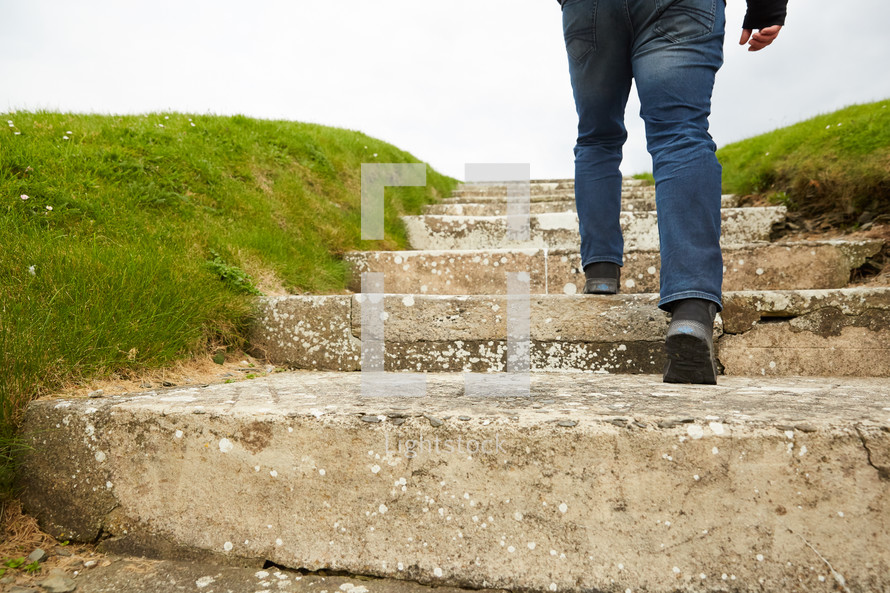 a man walking up steps outdoors 