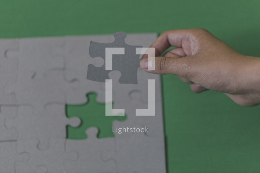 placing the final puzzle piece in place 