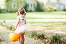 a child trick-or-treating on Halloween 