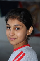 A young Chaldean Christian girl in a refugee camp in Northern Iraq. [For similar search Ethnic Face Smile]