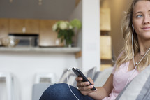 a woman listening to a podcast 