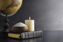 globe, Bible, candle and salt 