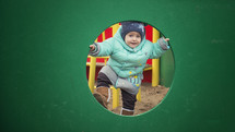 toddler at a playground in winter 