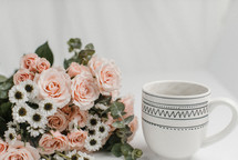 coffee cup and pink flowers 