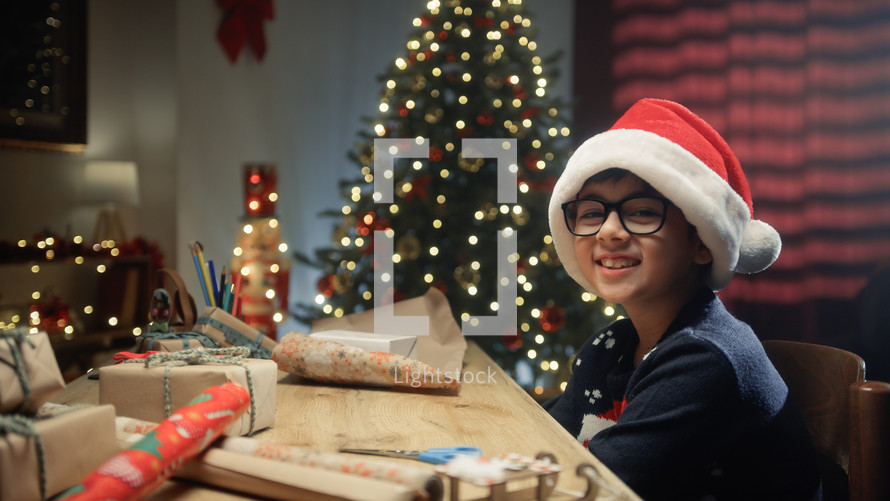 Kid Smile During Christmas Day On The Desk