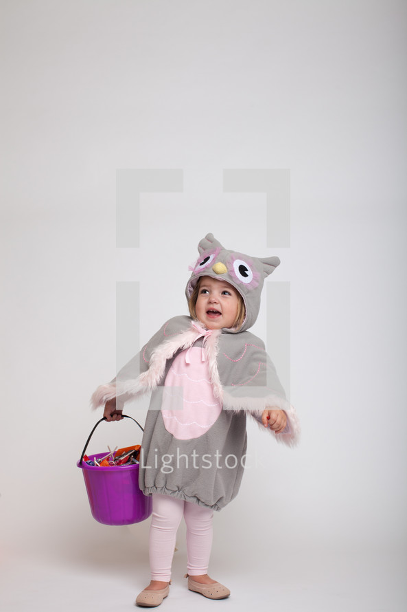 a toddler girl in a Halloween costume 