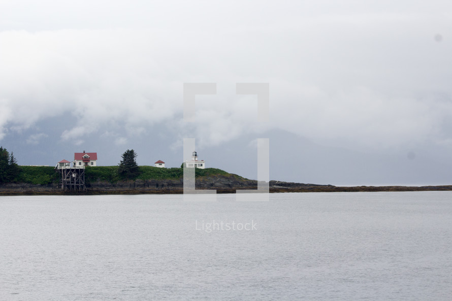 house and lighthouse on the coast of Alaska 