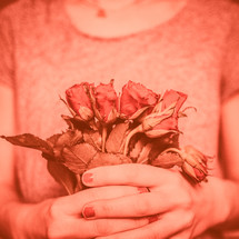 a woman holding roses 