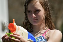 girl with a water gun 